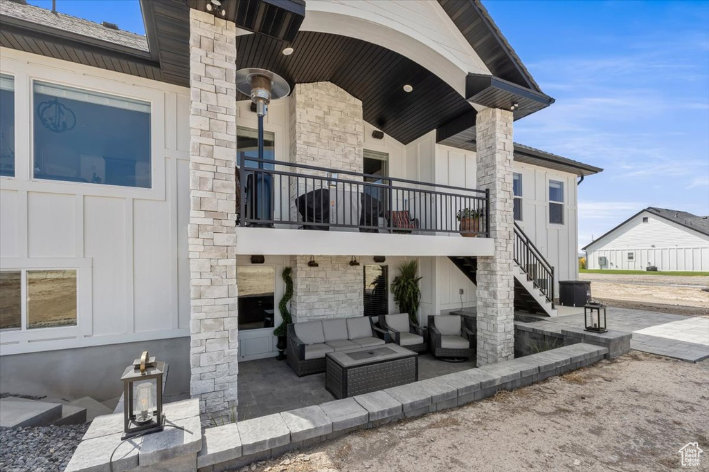 Exterior space featuring outdoor lounge area and a patio