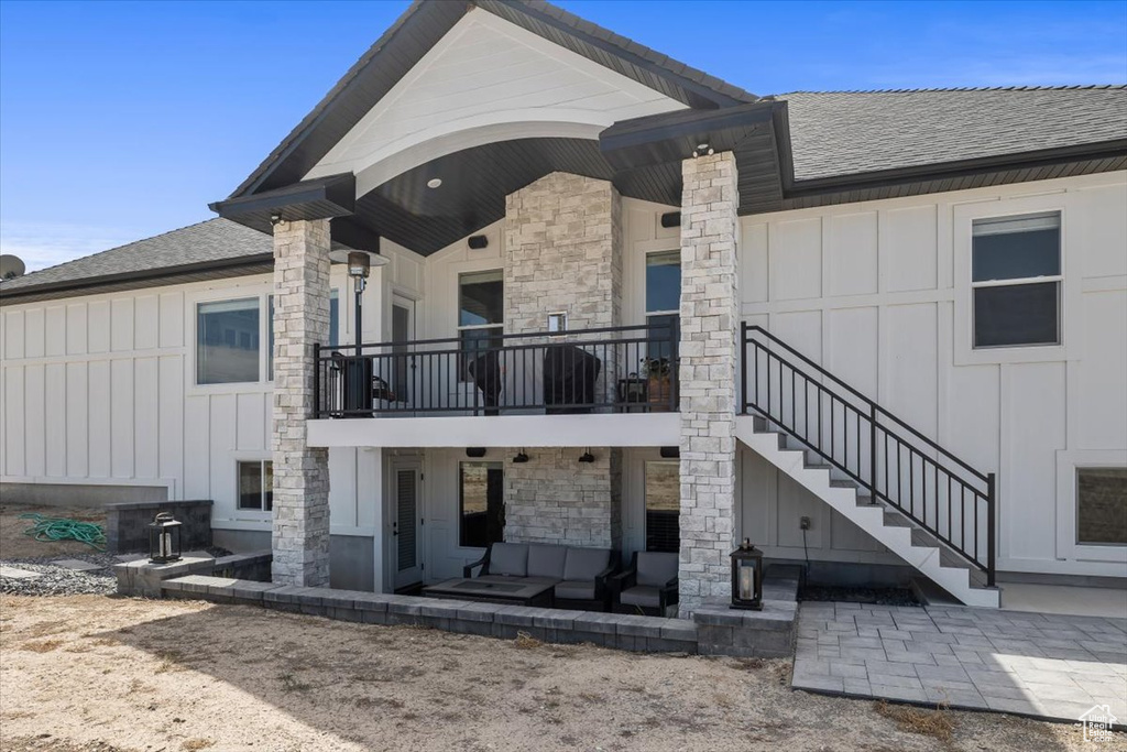 Rear view of house with a patio