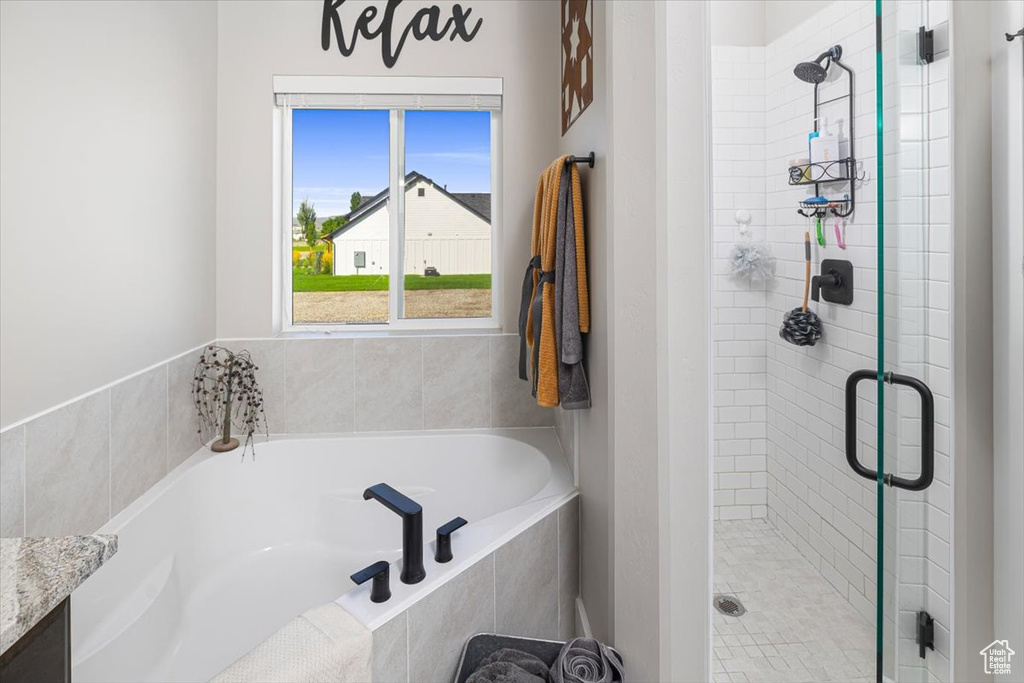 Bathroom with independent shower and bath and vanity