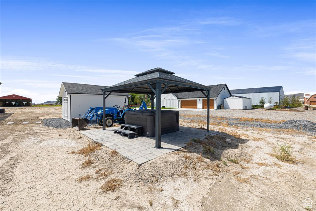 Exterior space featuring a gazebo and a hot tub