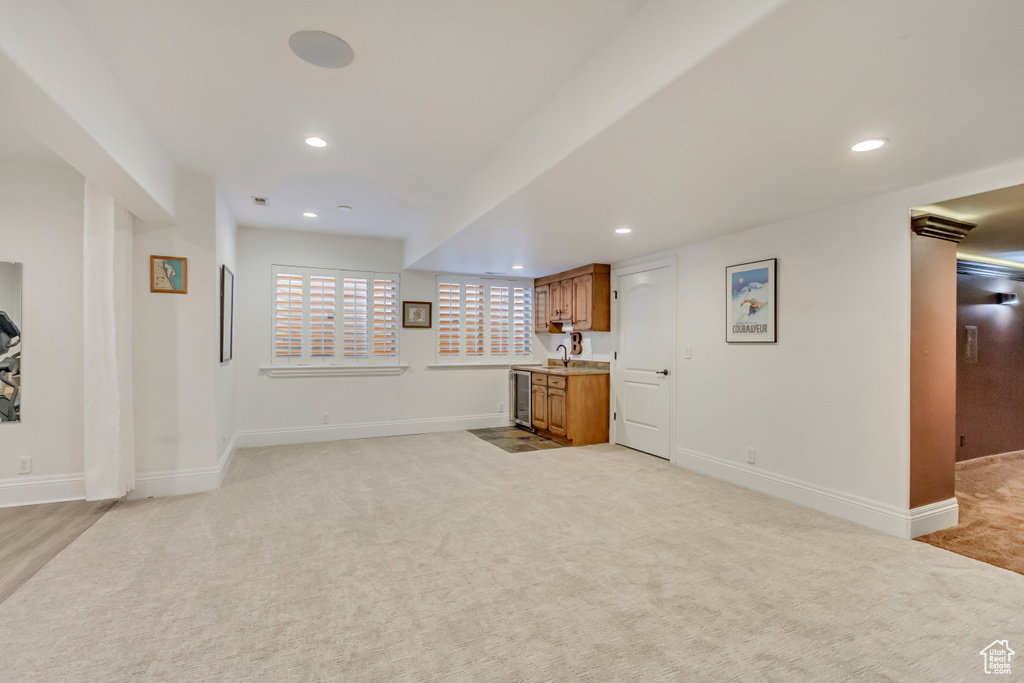 Interior space featuring light colored carpet