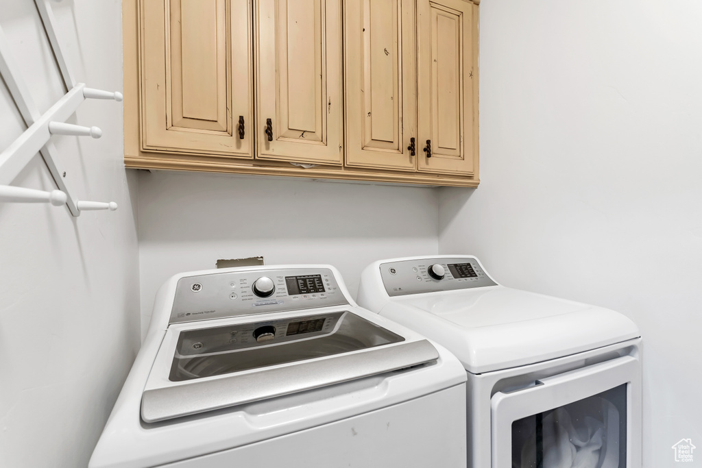 Clothes washing area with independent washer and dryer and cabinets