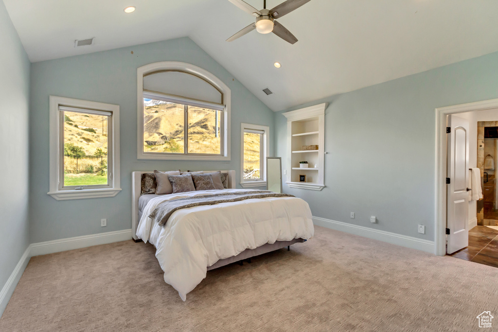 Bedroom with carpet, vaulted ceiling, and ceiling fan