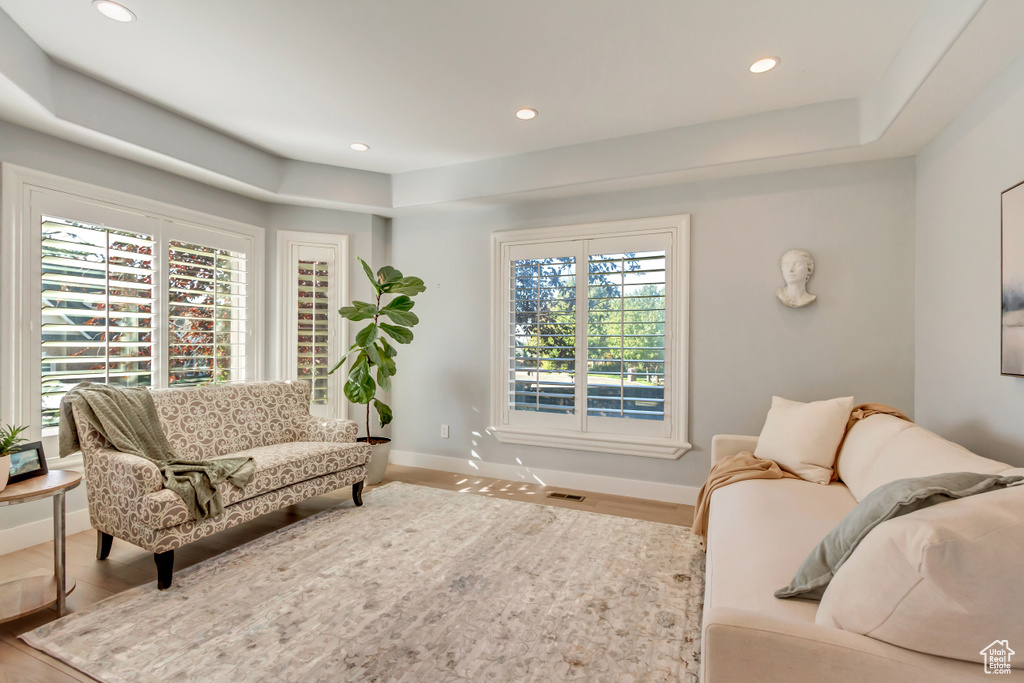 Living room featuring a wealth of natural light and hardwood / wood-style flooring