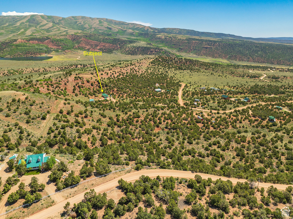 Birds eye view of property with a mountain view