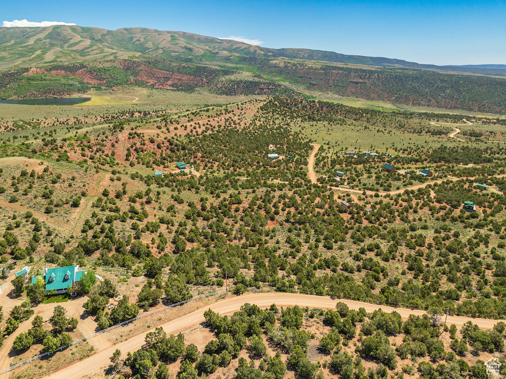 Birds eye view of property with a mountain view