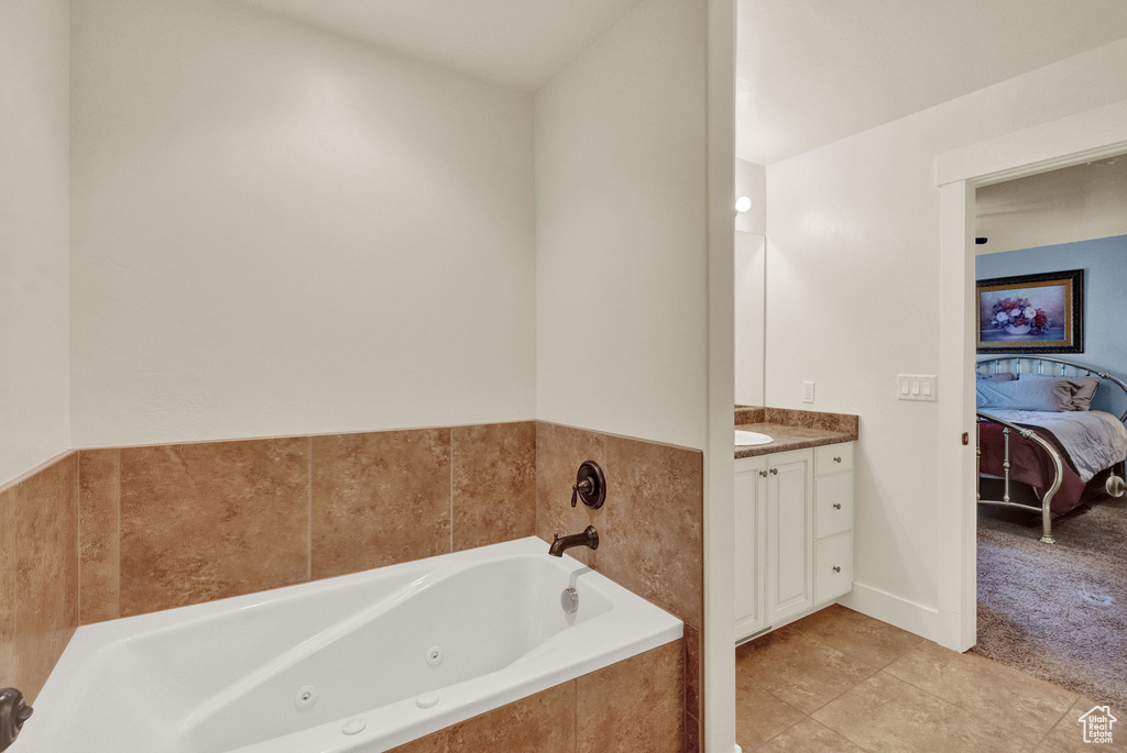 Bathroom featuring tile floors and vanity