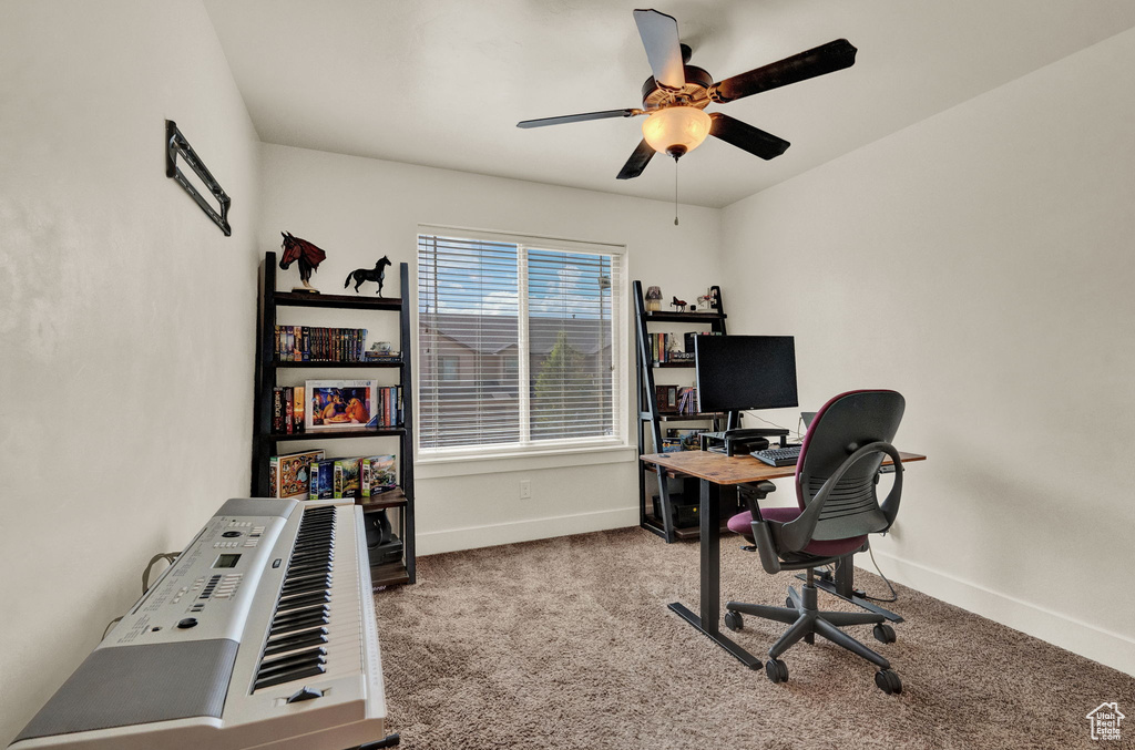 Office space with carpet flooring and ceiling fan