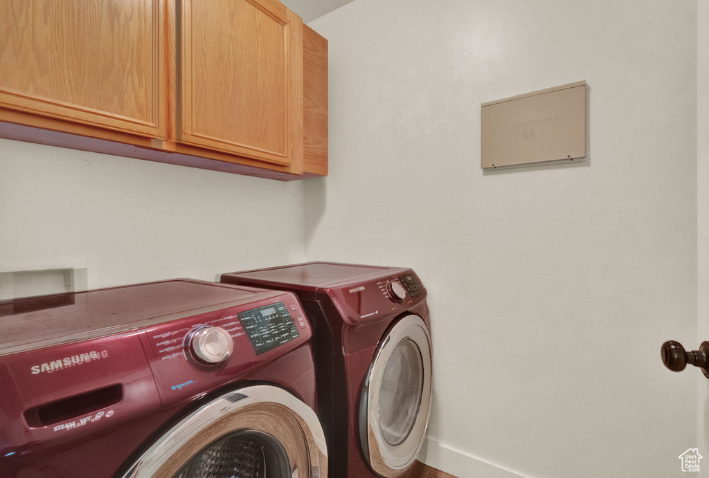 Clothes washing area with hookup for a washing machine, independent washer and dryer, and cabinets