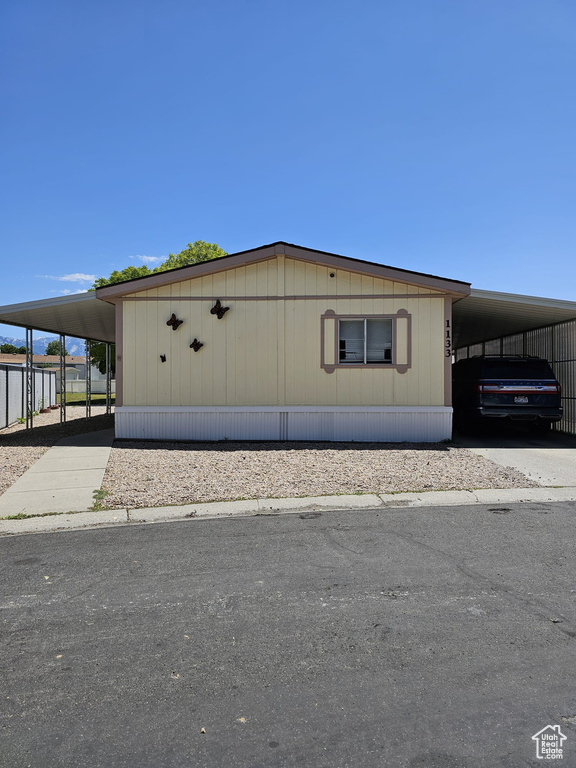 Exterior space featuring a carport