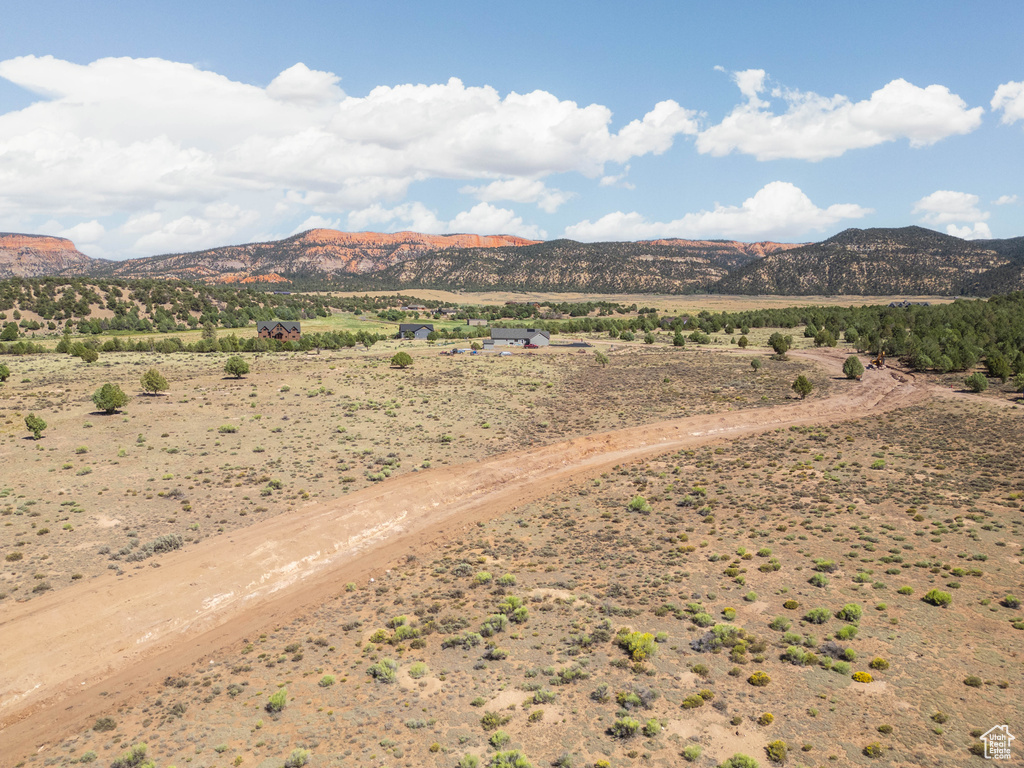 Property view of mountains with a rural view