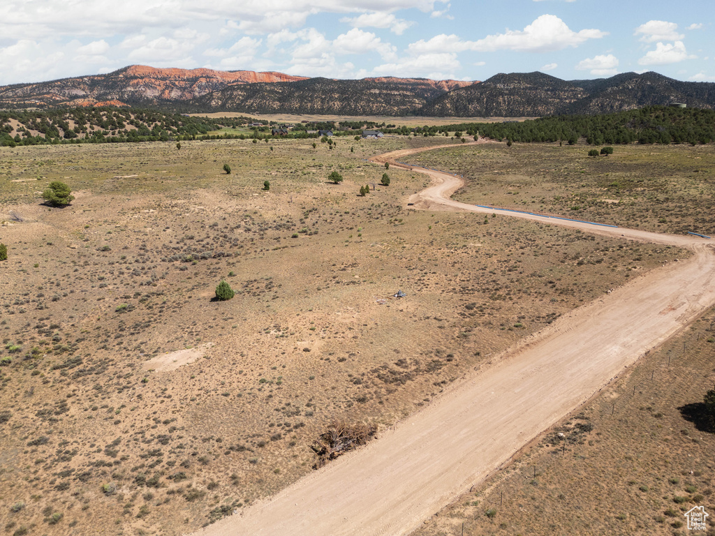 Property view of mountains with a rural view