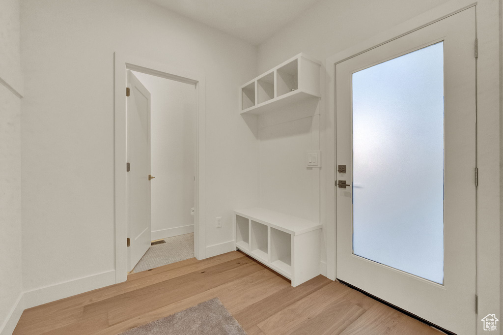 Mudroom featuring light wood-type flooring