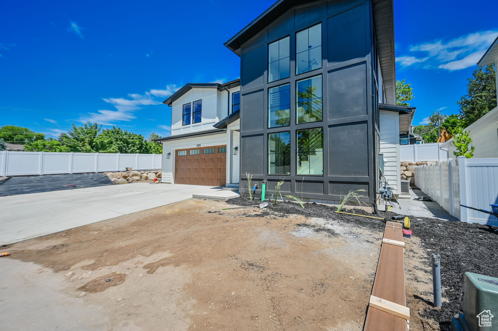 Exterior space with a patio and a garage