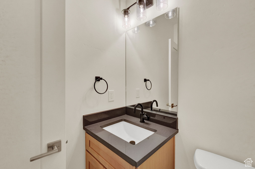 Bathroom with toilet and vanity