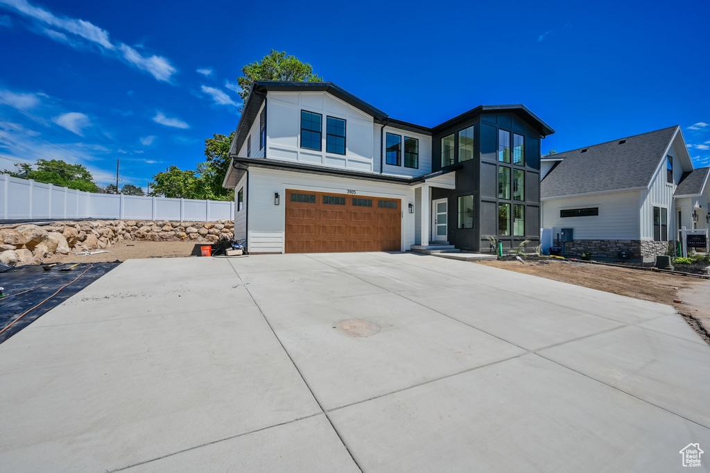 View of front of home featuring a garage