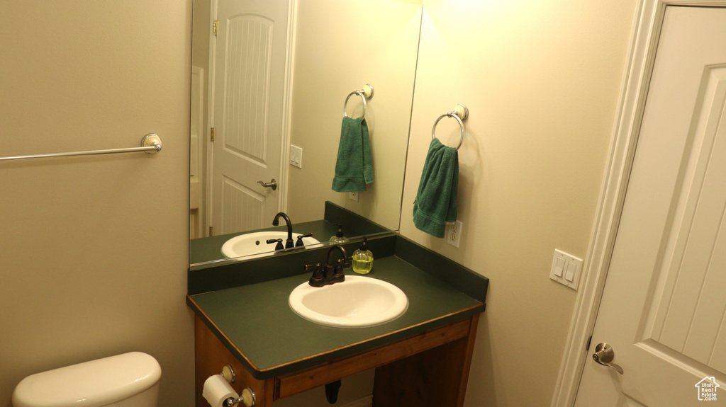 Bathroom with oversized vanity and toilet