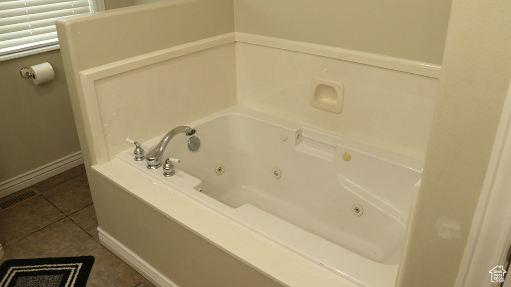 Bathroom featuring tile floors