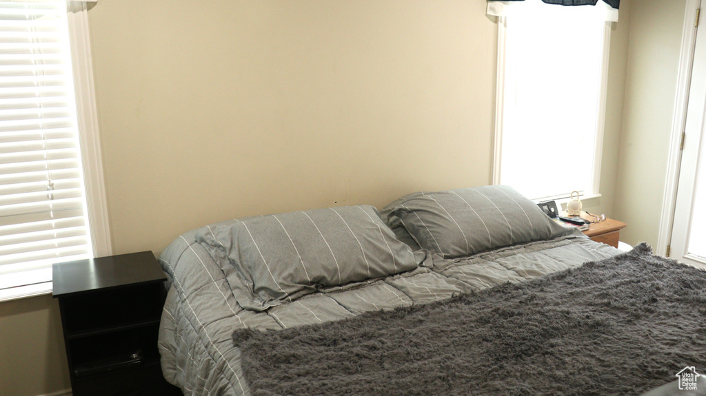 Bedroom featuring multiple windows