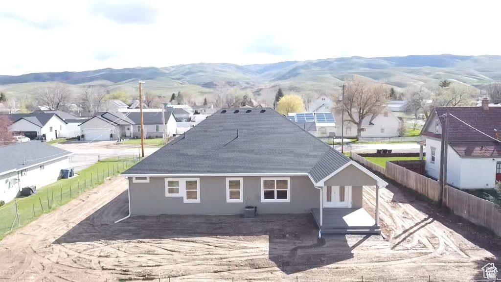 Back of house featuring a mountain view