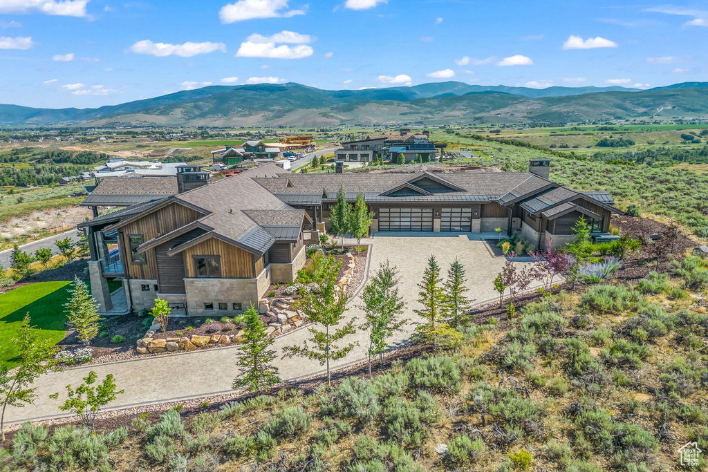 Birds eye view of property with a mountain view