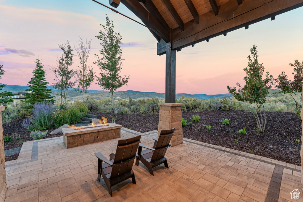 Patio terrace at dusk with a mountain view