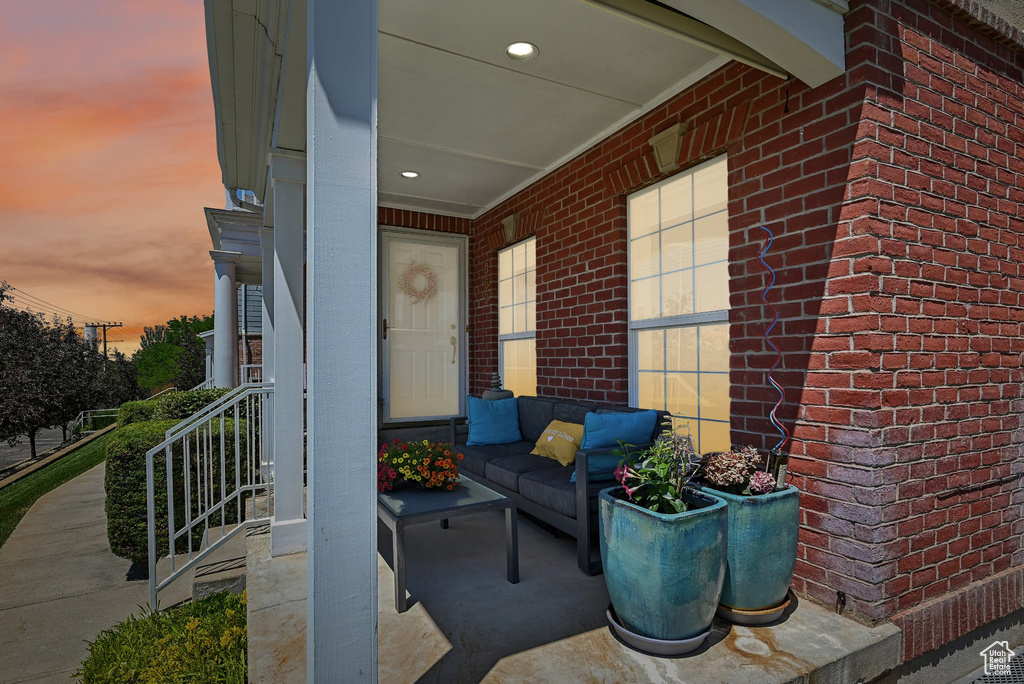 Patio terrace at dusk with covered porch