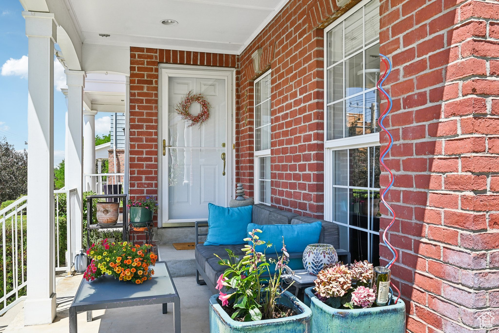 Entrance to property featuring covered porch