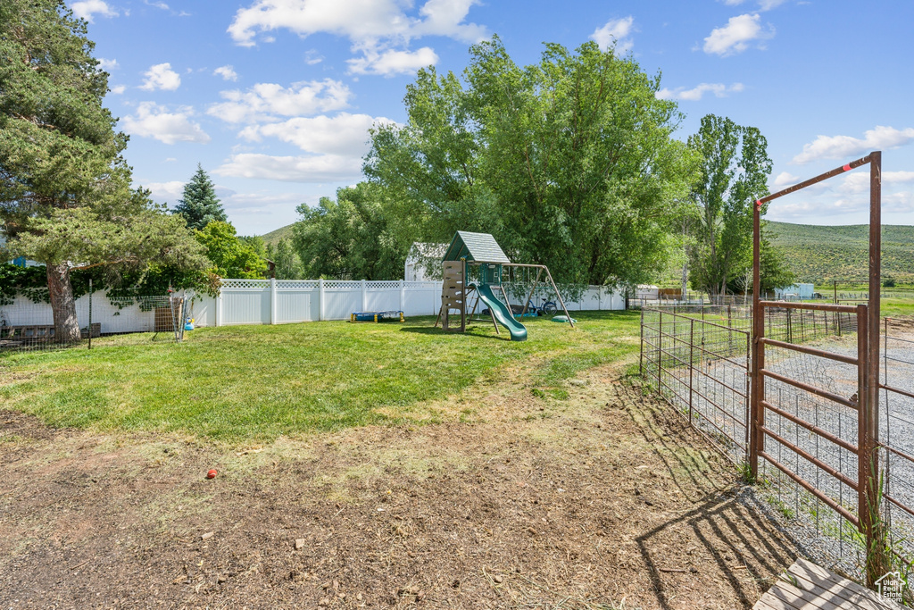 View of yard with a playground