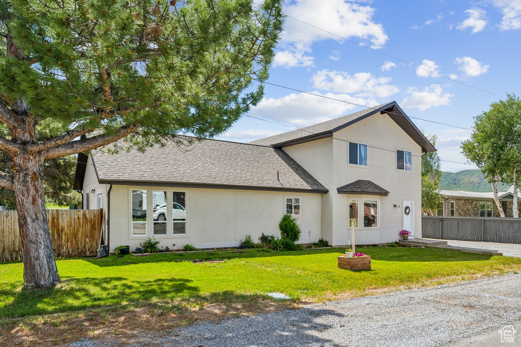 View of front of home with a front lawn