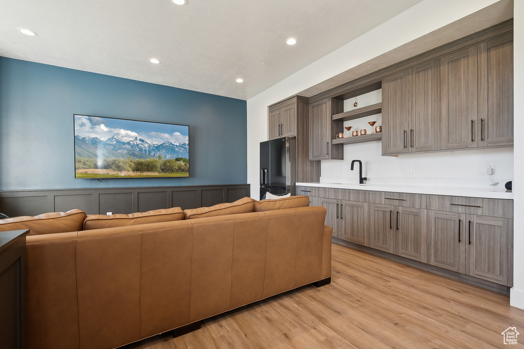 Living room featuring recessed lighting and light wood-style floors