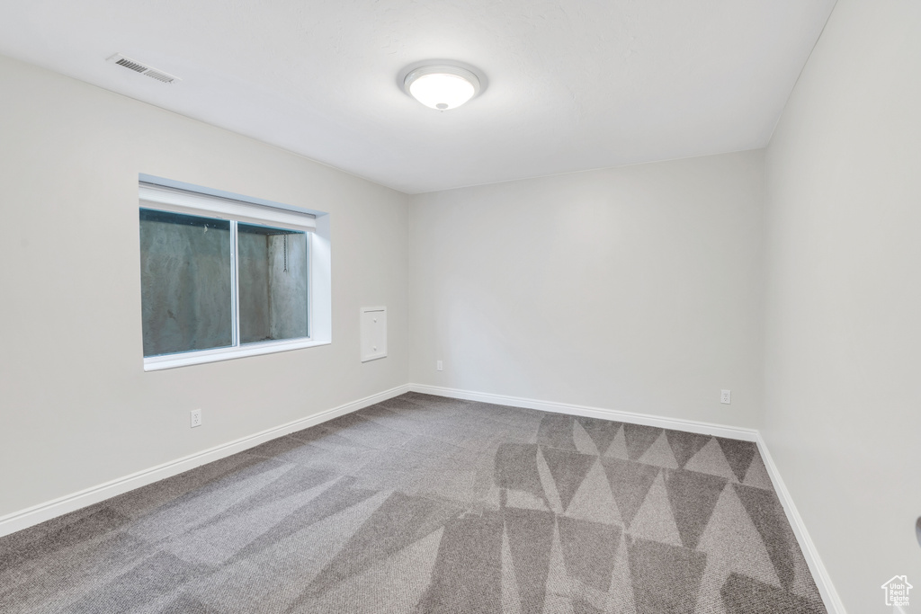 View of carpeted spare room