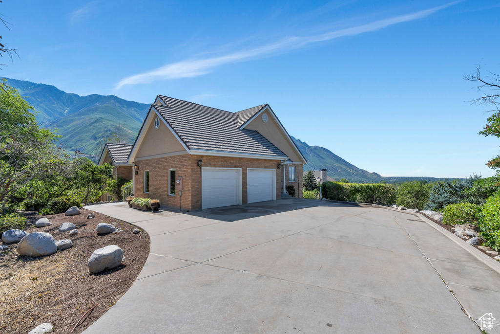 View of front of home featuring a mountain view