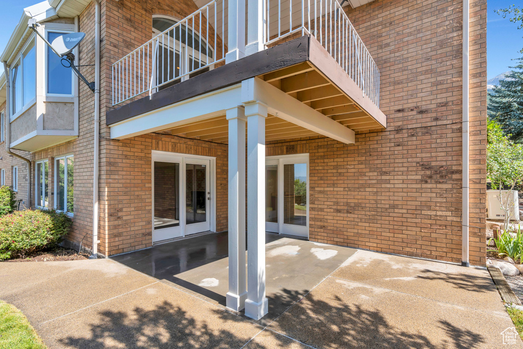 Back of house featuring a patio area and a balcony