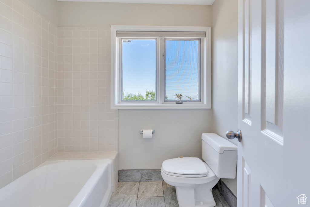 Bathroom with tile floors and toilet