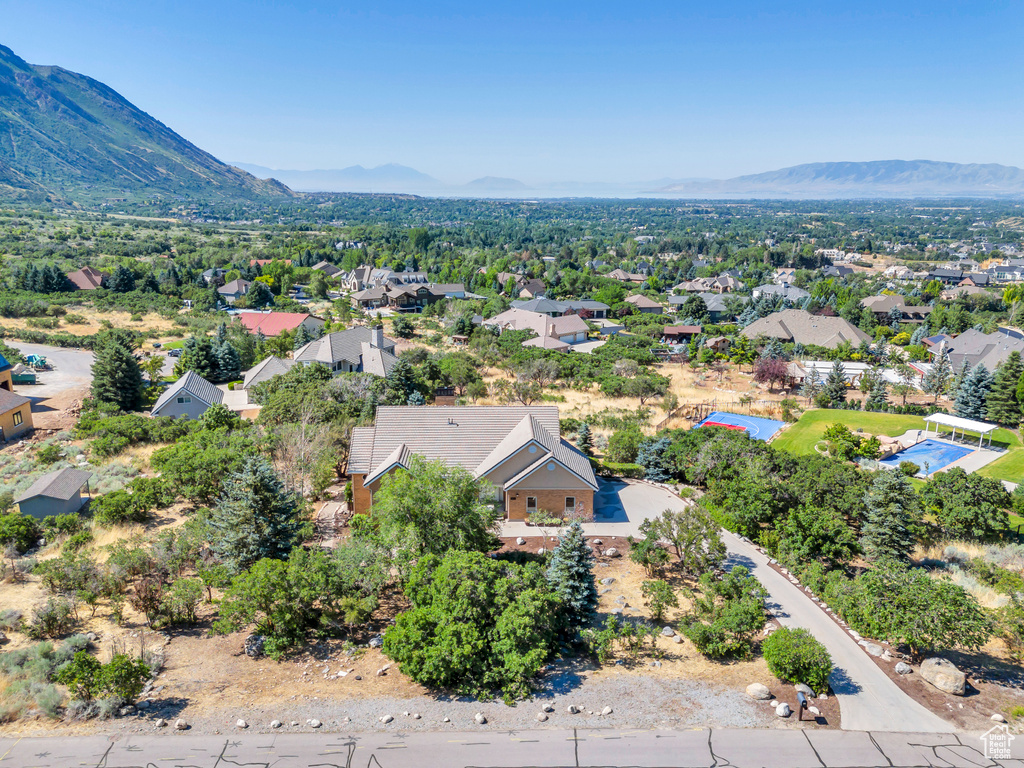 Birds eye view of property with a mountain view