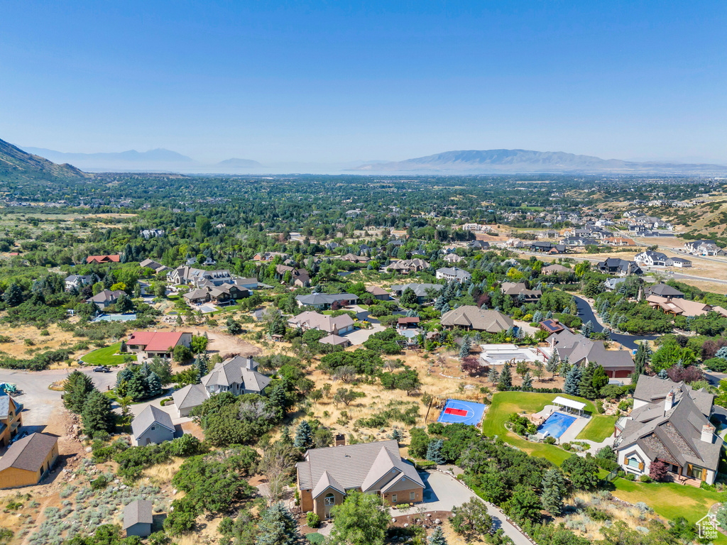 Birds eye view of property with a mountain view