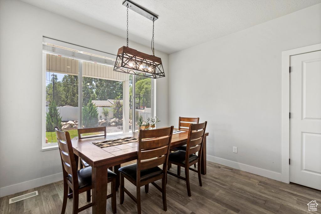 Dining space featuring dark hardwood / wood-style flooring