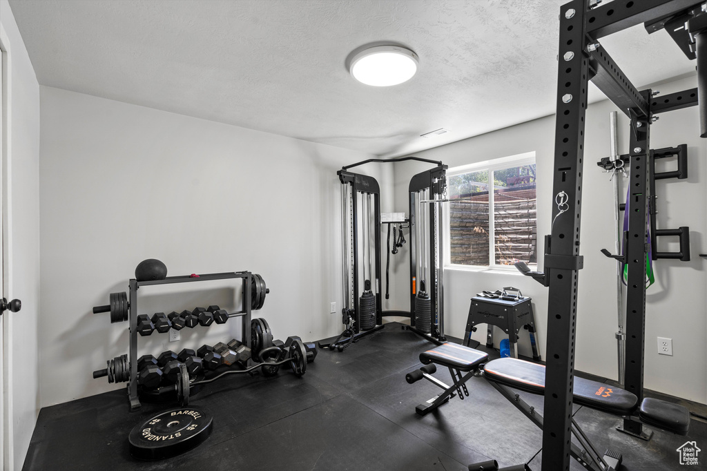 Workout area with a textured ceiling