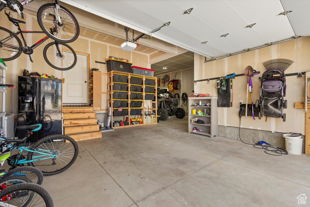 Garage featuring a garage door opener