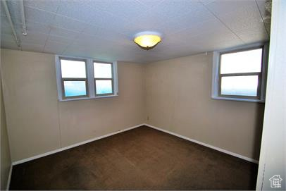 Spare room featuring carpet floors