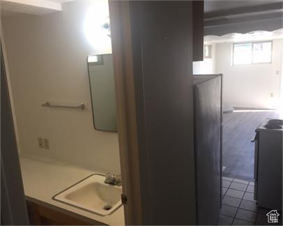 Bathroom featuring tile flooring and vanity