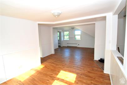 Unfurnished room with hardwood / wood-style floors