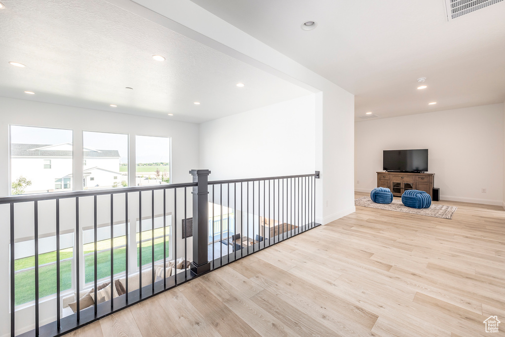 Hallway featuring light wood-type flooring