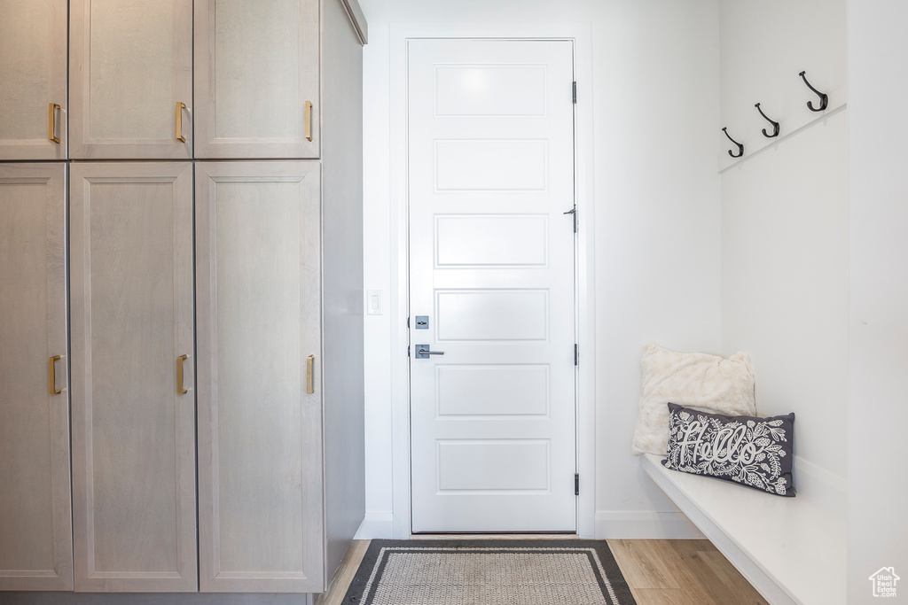 Mudroom with wood-type flooring