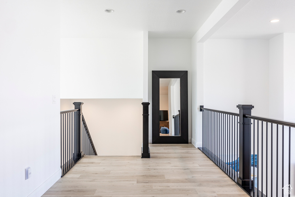 Hallway with light wood-type flooring