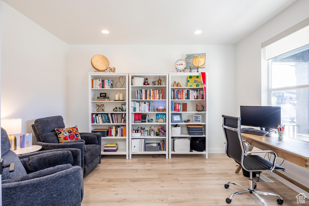 Office space featuring light hardwood / wood-style floors