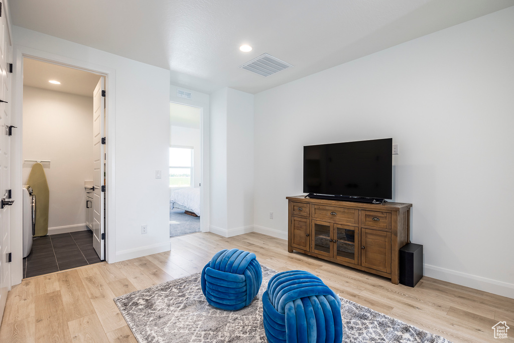 Tiled living room with washer / dryer