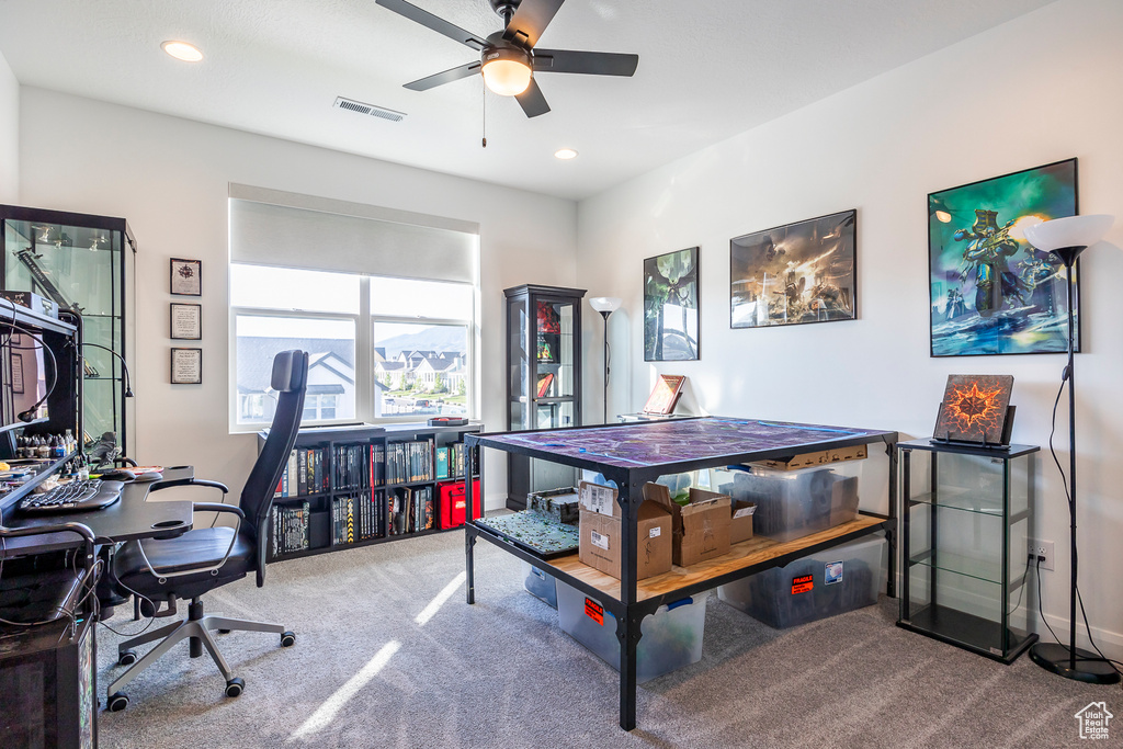 Carpeted bedroom with ceiling fan