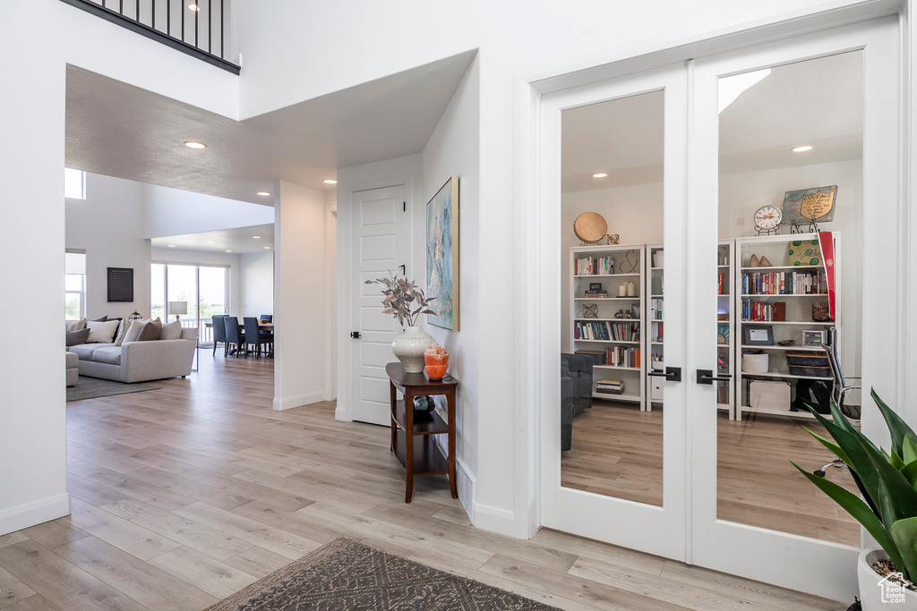 Interior space featuring french doors and light wood-type flooring